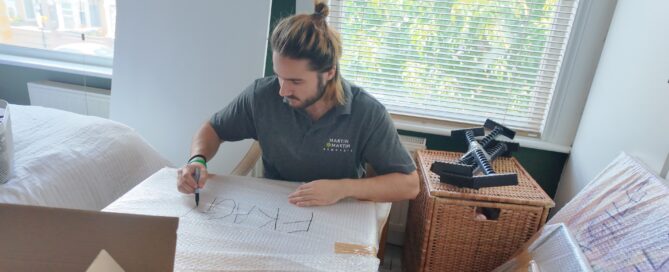 Martin & Martin Removals Team Member packing a client's home contents safely.