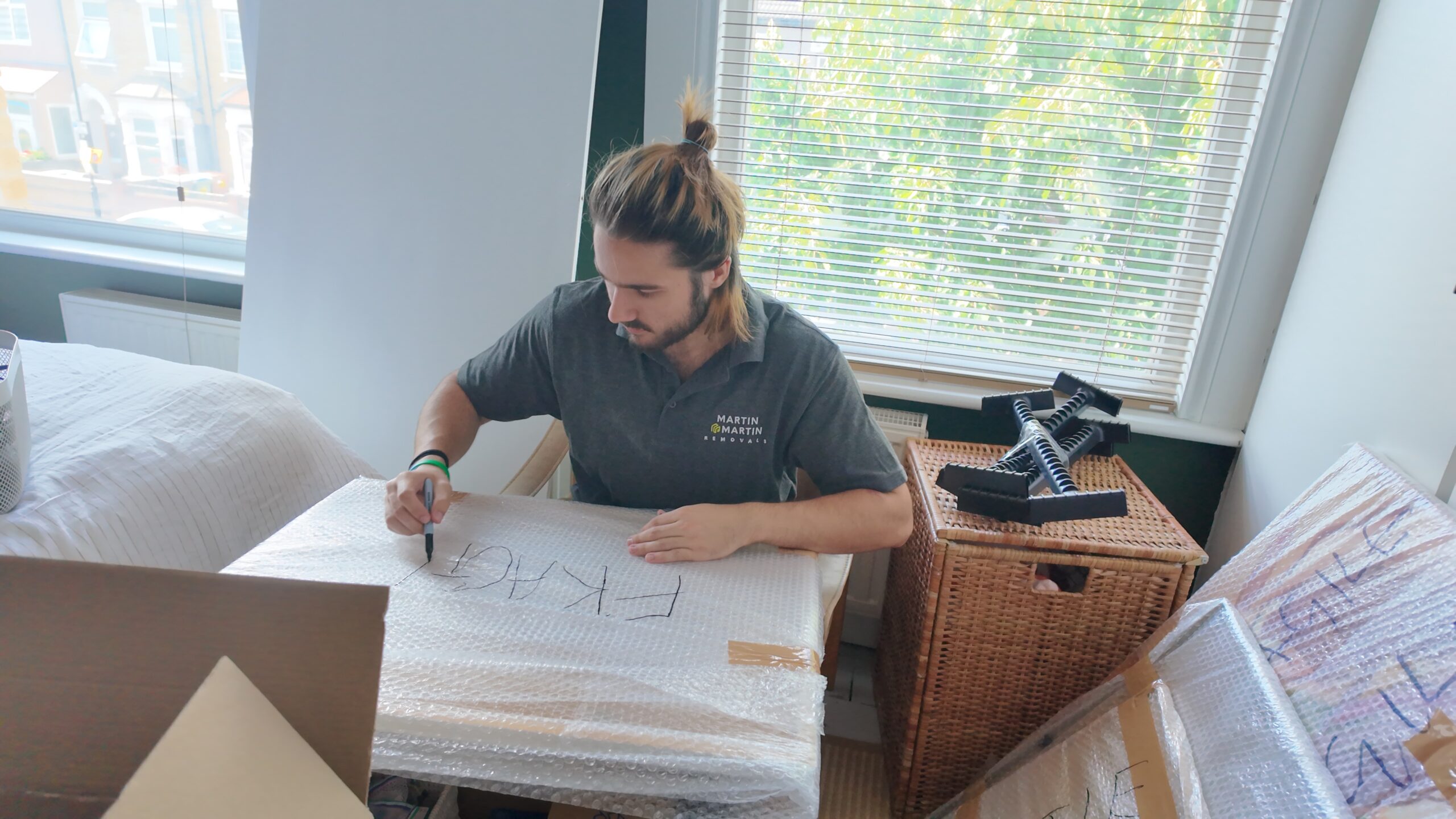 Martin & Martin Removals Team Member packing a client's home contents safely.